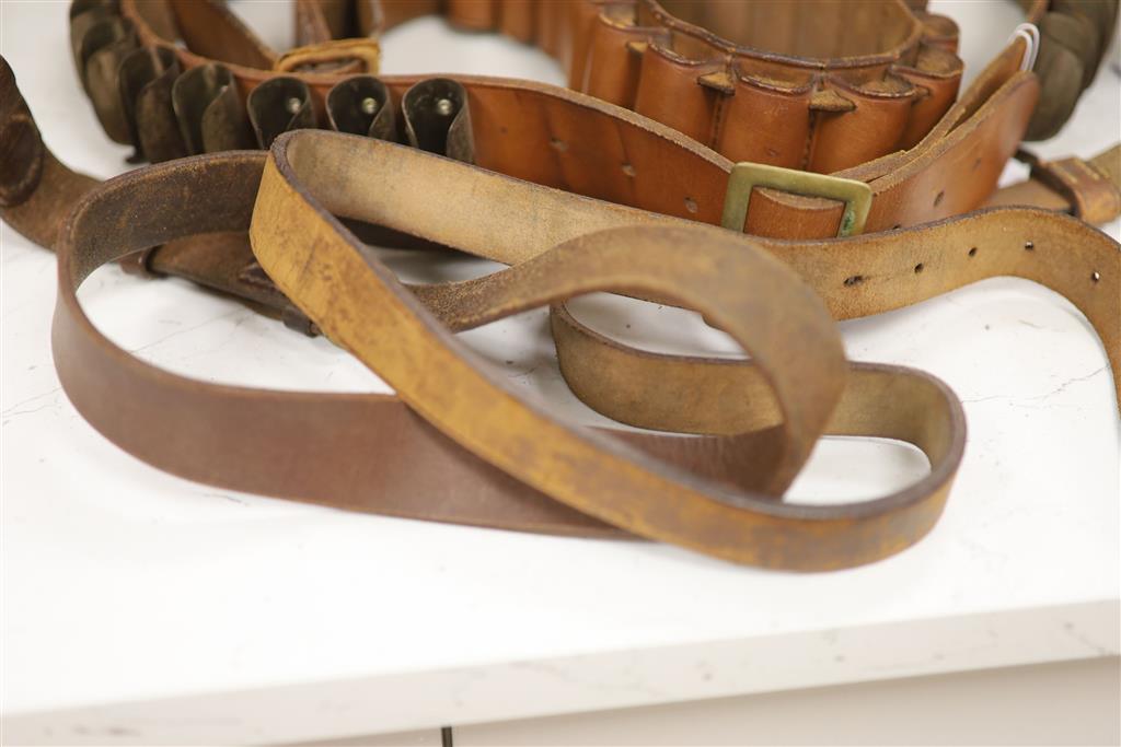 An Edwardian leather cartridge magazine and belts, case 36.5cm wide, 29cm deep